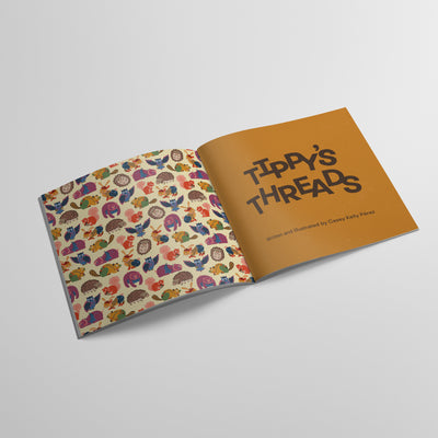 interior spread of Tippy's Threads book, title page spread with pattern of forest animals